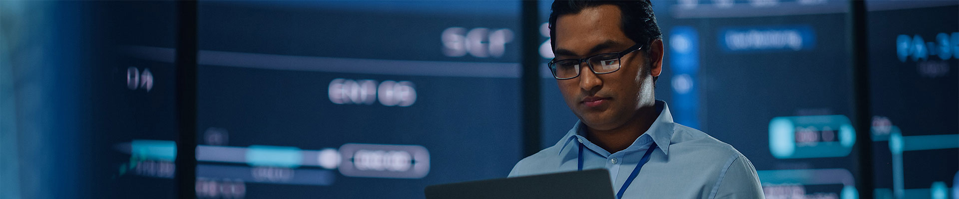 QinetiQ US's Advanced Cyber Tech banner with somebody working on a computer.