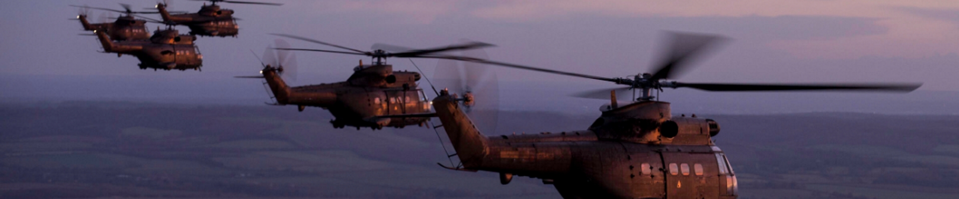 Five helicopters flying in formation