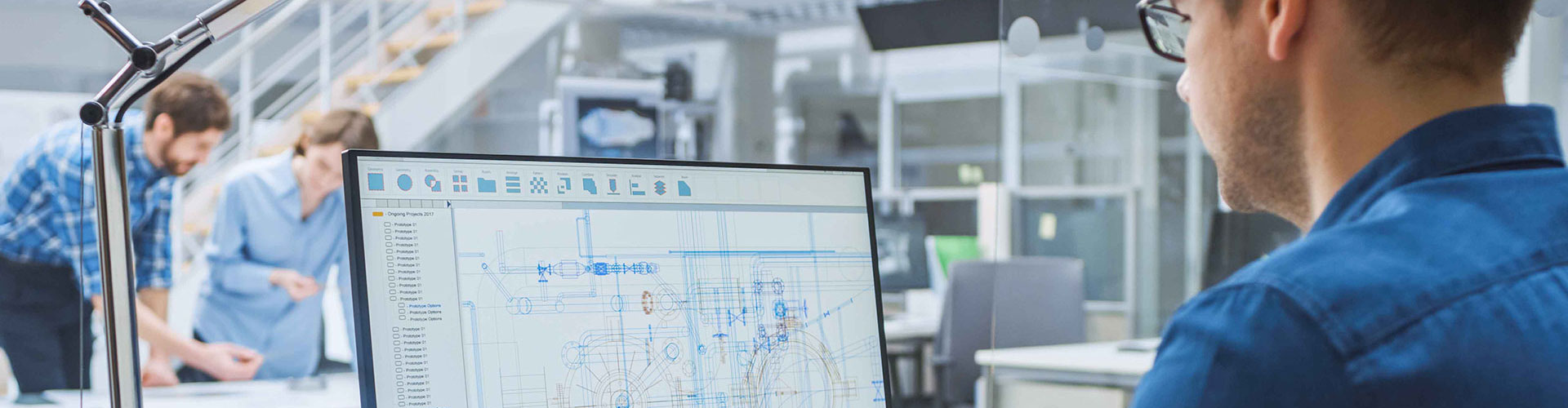 Employee sitting at computer screen in office