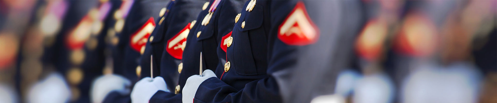US military badges displayed on marching soldiers