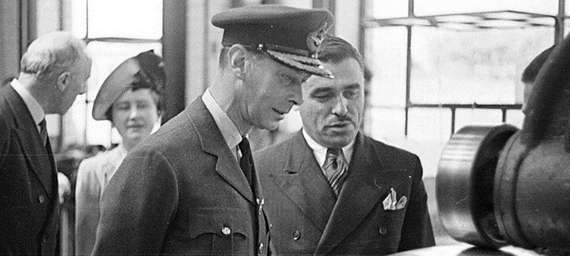 King George VI being shown how a H2S radar scanner dish is formed from sheet aluminium 1944