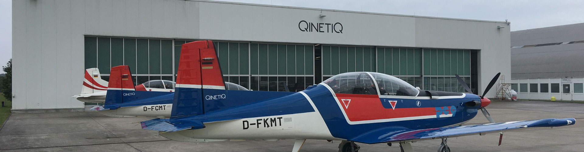 Aircraft in front of hangar
