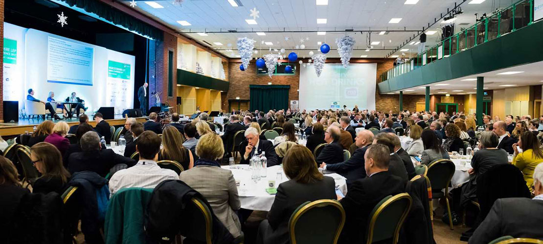 Worcestershire Local Enterprise Partnership awards showing and on stage panel and guests sitting at tables 