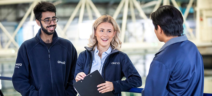 Three QinetiQ graduates by QinetiQ's Ocean Basin facility at Haslar