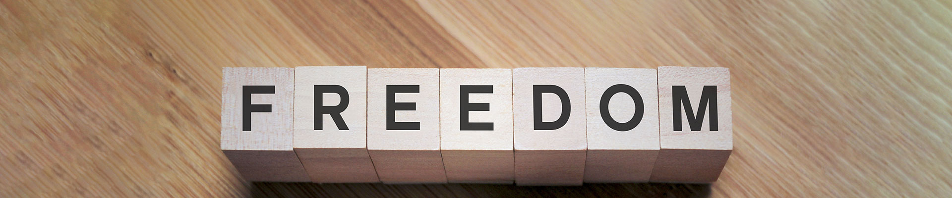 Image of the word FREEDOM spelt out in letter blocks