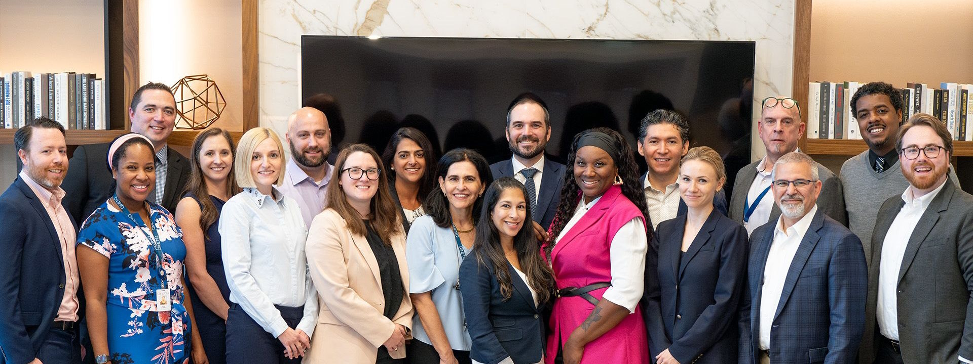 QineitQ US Employees standing for a group photo