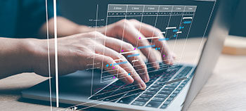 Hands typing on keyboard