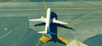 Airfields - overhead view of aeroplane on tarmac taxiway runway