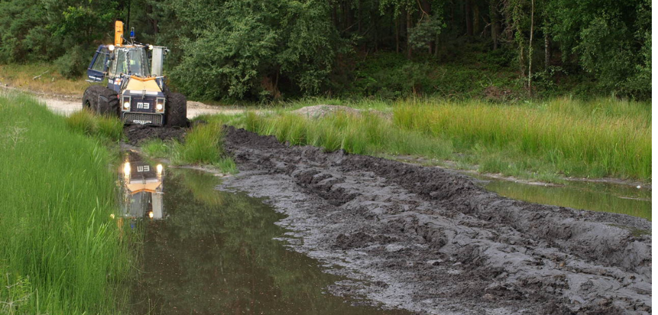Vehicle driving through Pete Bogging Tank at Hurn Proving Ground
