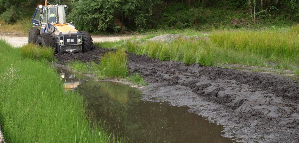 Vehicle driving through Pete Bogging Tank at Hurn Proving Ground