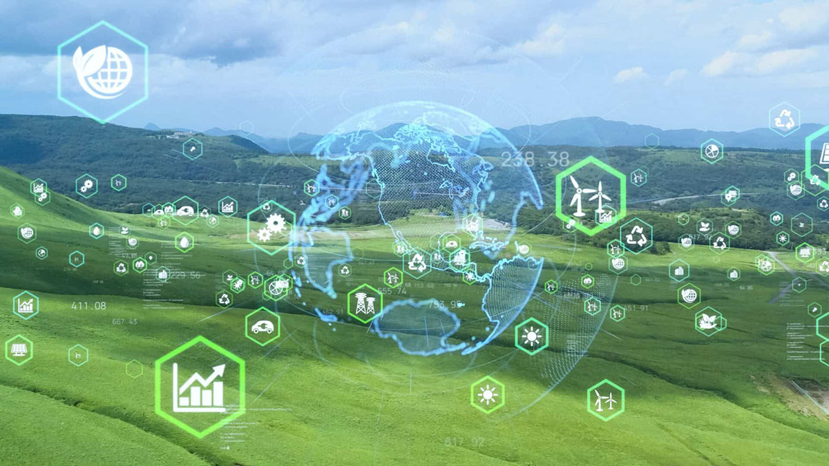 A digital landscape overlaying green rolling hills with icons for wind energy, recycling, and solar power, centered around a blue wireframe globe.