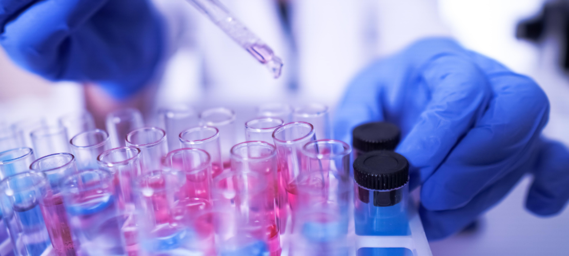 Mission-Led Innovation - image showing lab scientist with pipette and test tubes