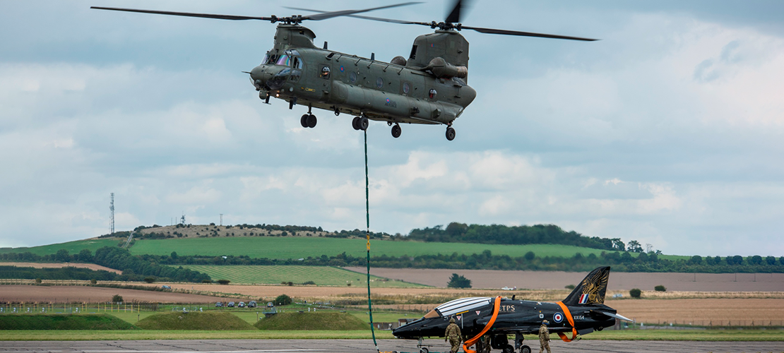 Chinook heavy lift helicopter preparing to lift Hawk XX154 from Boscombe Down