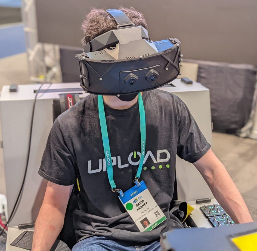 Metaverse - user wearing XTAL 3 virtual reality headset with 180 degree fov