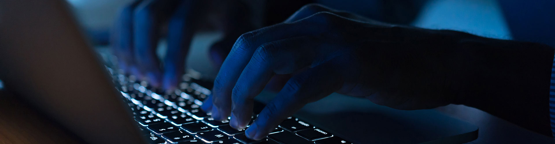 Hand typing on a keyboard