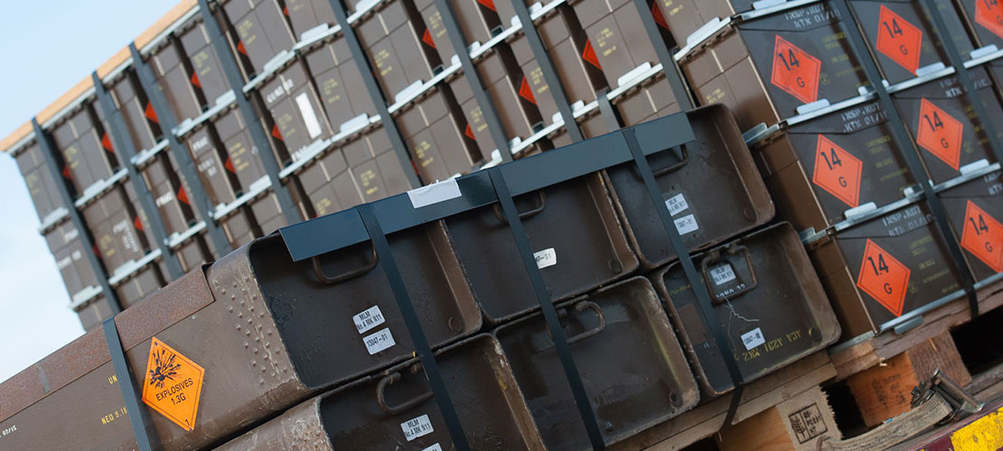 Mortar disposal showing secured cases of explosives on pallets