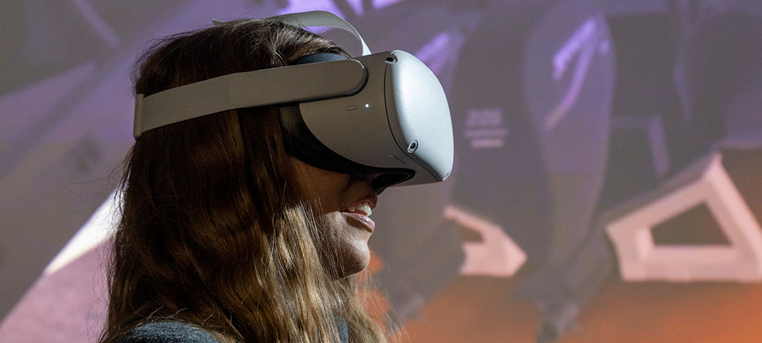 Graduate wearing VR headset