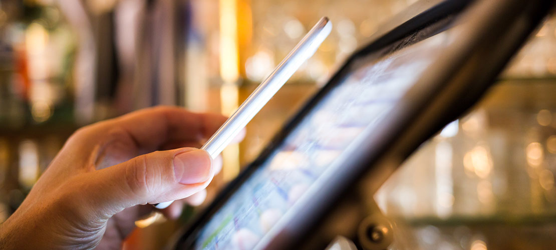 Nano Manufacturing image depicting RFID use on smartphone near electronic display device