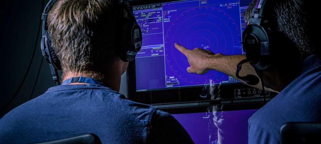 Two men looking at monitor